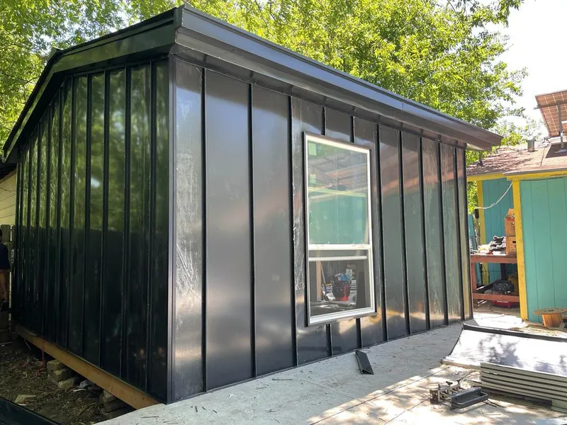 Black standing seam metal wall panels for Roof Inspection in Hiawatha