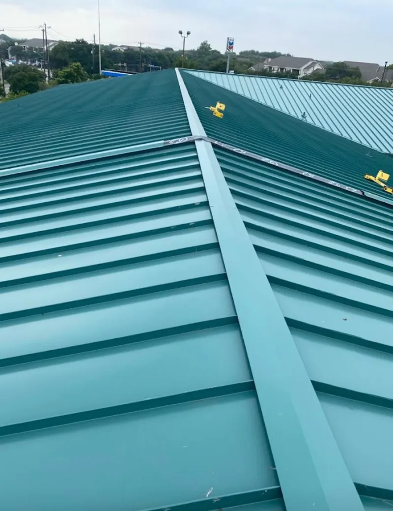 Green commercial metal roof ridge and valley for Metal Roof Repair in Hiawatha